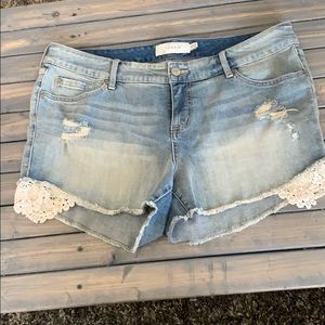 Jean shorts with lace detailing and distress